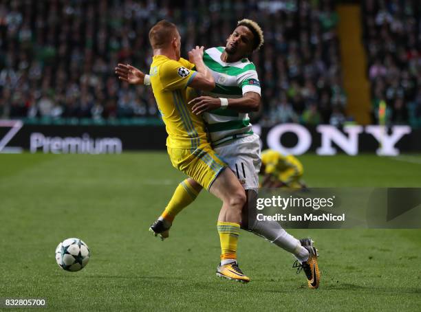 Scott Sinclair of Celtic vies with Laszlo Kleinheisler of FC Astana during the UEFA Champions League Qualifying Play-Offs Round First Leg match...