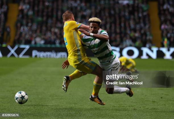 Scott Sinclair of Celtic vies with Laszlo Kleinheisler of FC Astana during the UEFA Champions League Qualifying Play-Offs Round First Leg match...