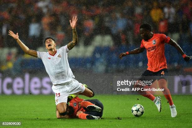 Sevilla's Joaquin Correa vies for the ball with Basaksehir's Mahmut Tekdemir and Joseph Attamah during the UEFA Champions League play-off first leg...