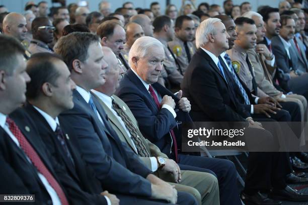 Attorney General Jeff Sessions waits to be introduced to speak at PortMiami on what he said is a growing trend of violent crime in sanctuary cities...