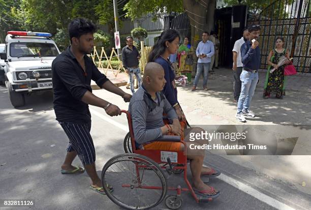 People arrive to wish Delhi Chief Minister Arvind Kejriwal on his birthday at his government residence on August 16, 2017 in New Delhi, India. AAP...