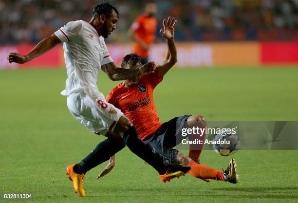 Mossoro of Medipol Basaksehir in action against Walter Montoya of Sevilla FC during the UEFA Champions League play-off match between Medipol...