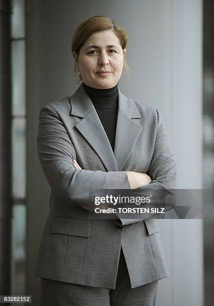 German author of Turkish origin Serap Cileli poses with her latest book "Eure Ehre - unser Leid" at the Frankfurt Book Fair on October 15, 2008....