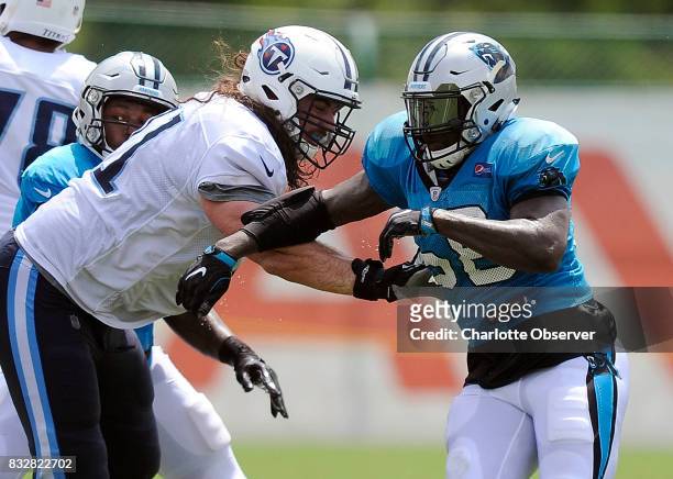 Carolina Panthers outside linebacker Thomas Davis goes up against Tennessee Titans offensive tackle Dennis Kelly during a joint practice on...