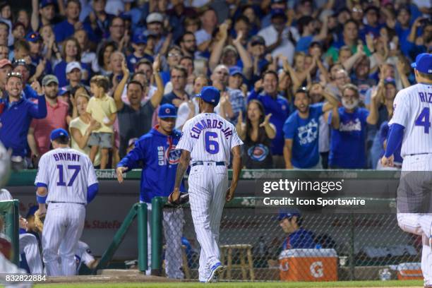 Chicago Cubs pitcher Carl Edwards Jr. Walks into the dugout after striking out Cincinnati Reds center fielder Billy Hamilton in the 7th inning during...