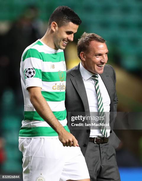 Celtic manager Brendan Rodgers celebrates at full time with Tomas Rogic of Celtic during the UEFA Champions League Qualifying Play-Offs Round First...