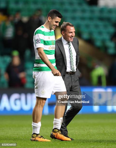Celtic manager Brendan Rodgers celebrates at full time with Tomas Rogic of Celtic during the UEFA Champions League Qualifying Play-Offs Round First...