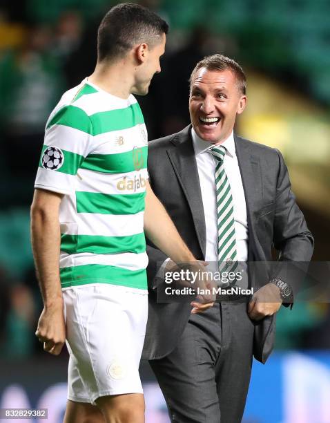 Celtic manager Brendan Rodgers celebrates at full time with Tomas Rogic of Celtic during the UEFA Champions League Qualifying Play-Offs Round First...