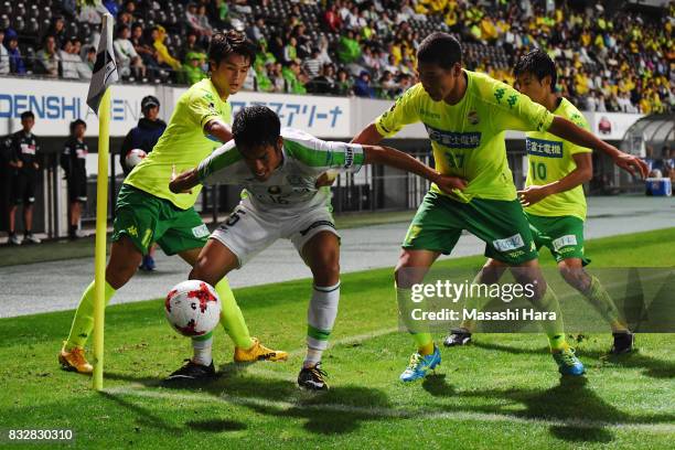 Ryunosuke Noda of Shonan Bellmare, Kim Byeom Yong and Hirotaka Tameda of JEF United Chiba compete for the ball during the J.League J2 match between...