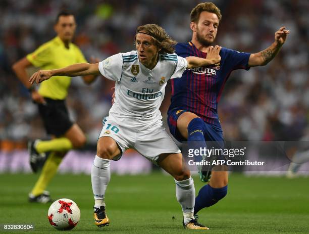 Real Madrid's Croatian midfielder Luka Modric vies with Barcelona's Croatian midfielder Ivan Rakitic during the second leg of the Spanish Supercup...