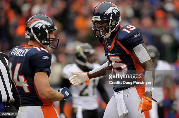 Wide receiver Brandon Stokley of the Denver Broncos celebrates his 11 yard touchdown reception with Brandon Marshall against the Jacksonville Jaguars...