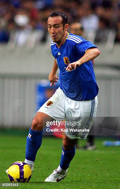 Marcus Tulio Tanaka of Japan controls the ball during the 2010 FIFA World Cup qualifier match between Japan and Uzbekistan at Saitama Stadium on...