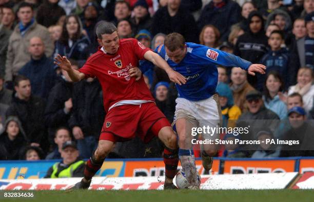 Birmingham City's Gary McSheffrey battles with Cardiff City's Kevin McNaughton during the Coca-Cola Championship match at St Andrews, Birmingham.