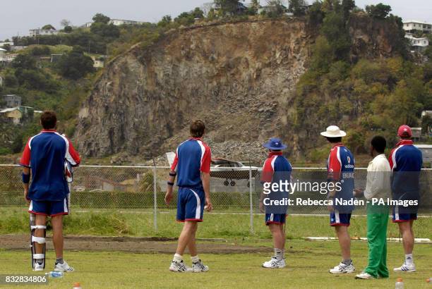 England stop net practice to watch a plane arrive at the airport next door to the Arnos Vale Sports Complex, St Vincent.
