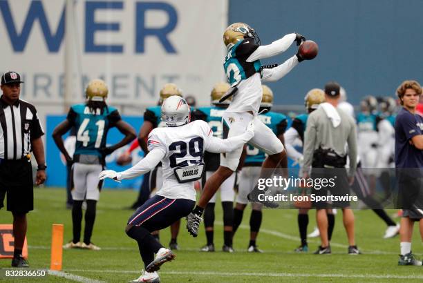 Jacksonville Jaguars wide receiver Rashad Greene Sr. Makes a catch over New England Patriots defensive back D.J. Killings during a joint New England...