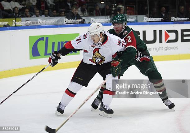 Nick Foligno of the Ottawa Senators stickhandles the puck against Johan Andersson of the Frolunda Indians at Scandinavium Arena on October 2, 2008 in...