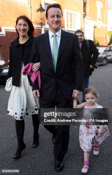 David Cameron arrives with his wife Sam and their daughter Nancy for the wedding of Jane Hardman and Alan Parker at Christ Church, Kensington.