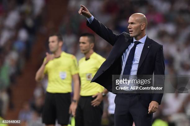 Real Madrid's French coach Zinedine Zidane gestures on the sideline during the second leg of the Spanish Supercup football match Real Madrid vs FC...