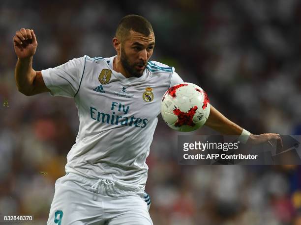 Real Madrid's French forward Karim Benzema controls the ball during the second leg of the Spanish Supercup football match Real Madrid vs FC Barcelona...