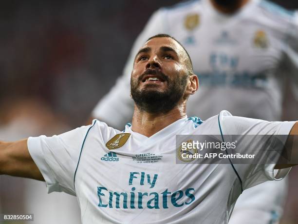 Real Madrid's French forward Karim Benzema celebrates after scoring their second goal during the second leg of the Spanish Supercup football match...