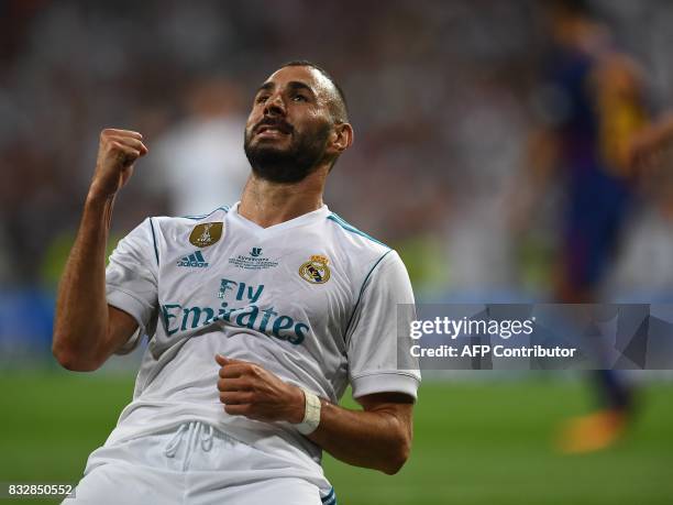 Real Madrid's French forward Karim Benzema celebrates after scoring their second goal during the second leg of the Spanish Supercup football match...