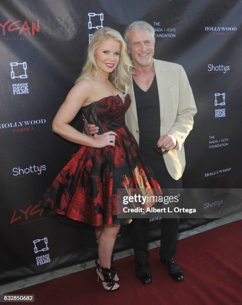 Producer Crystal Hunt and actor Michael Swan arrive for the Premiere Of Parade Deck’s “Lycan” held at Laemmle's Ahrya Fine Arts Theatre on August 15,...