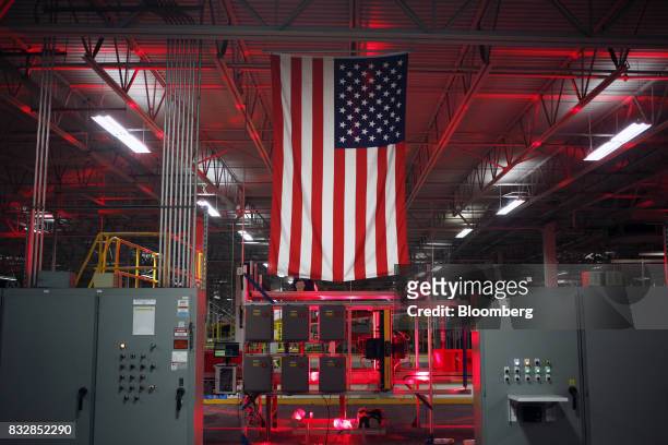 An American flag is displayed inside the DHL Worldwide Express hub of Cincinnati/Northern Kentucky International Airport in Hebron, Kentucky, U.S.,...