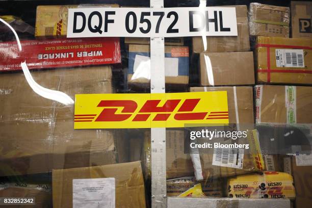 Packages are pictured inside a container at the DHL Worldwide Express hub of Cincinnati/Northern Kentucky International Airport in Hebron, Kentucky,...