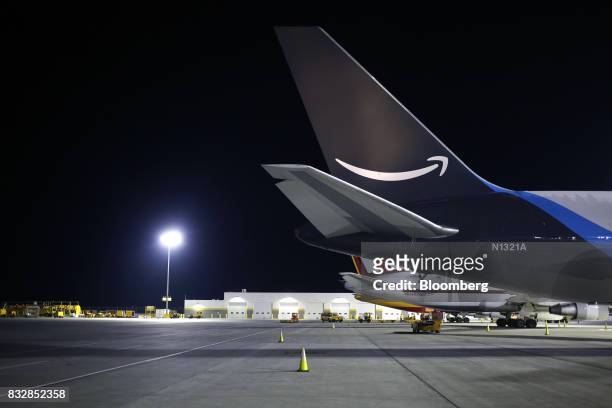 An Amazon.com Inc. Prime Air cargo jet sits parked at the DHL Worldwide Express hub of Cincinnati/Northern Kentucky International Airport in Hebron,...