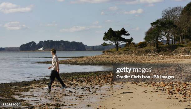 Scout Jon Grimes takes a look around the site on Brownsea Island in Poole Harbour, Dorset where Lord Robert Baden-Powell held his experimental camp...