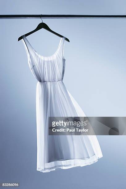 dress on hanger - coat hanger stock pictures, royalty-free photos & images