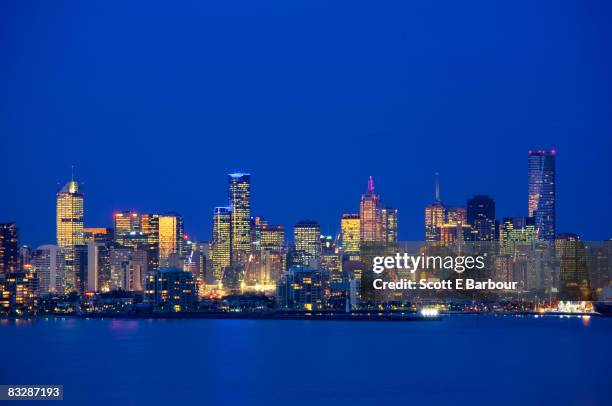 view across port phillip bay, melbourne skyline - melbourne city at night ストックフォトと画像