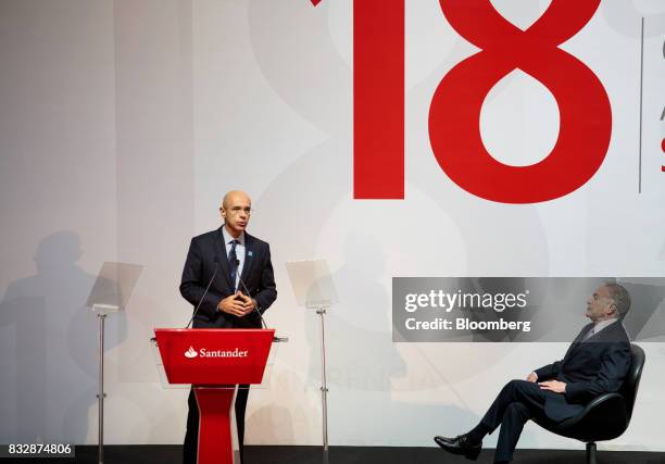 Sergio Rial, chief executive officer for Banco Santander Brasil SA, left, speaks while Michel Temer, Brazil's president, listens during the Annual...