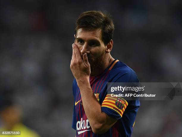 Barcelona's Argentinian forward Lionel Messi gestures during the second leg of the Spanish Supercup football match Real Madrid vs FC Barcelona at the...