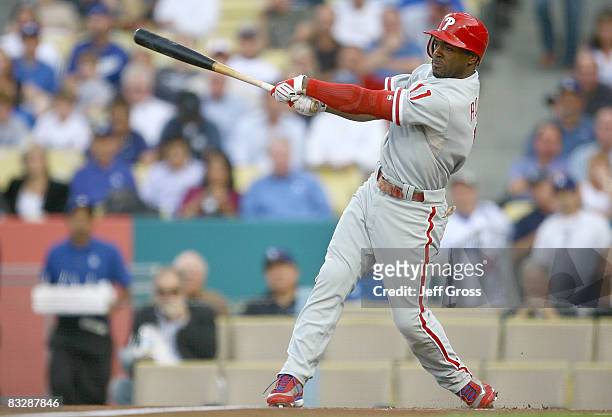 Jimmy Rollins of the Philadelphia Phillies swings at a ptch by Chad Billingsley of the Los Angeles Dodgers in the first inning of Game Five of the...
