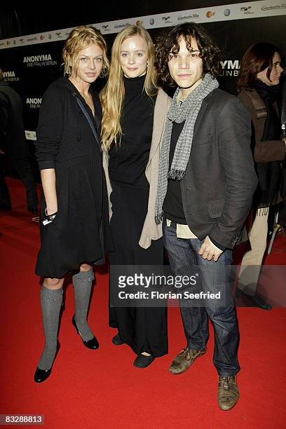 Actress Isabell Gerschke and actor Sebastian Urzendowsky and actress Wanda Perdelwitz attends the premiere of 'Anonyma - a woman in Berlin' at the...
