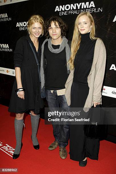 Actress Isabell Gerschke and actor Sebastian Urzendowsky and actress Wanda Perdelwitz attends the premiere of 'Anonyma - a woman in Berlin' at the...