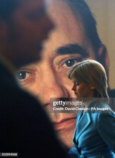 Poster of the leader of the Scottish National Party Alex Salmond looks out from behind the Deputy leader Nicola Sturgeon at their campaign launch in...