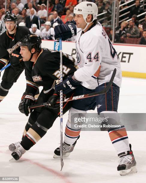 Sheldon Souray of the Edmonton Oilers defends against Travis Moen of the Anaheim Ducks during the game on October 15, 2008 at Honda Center in...