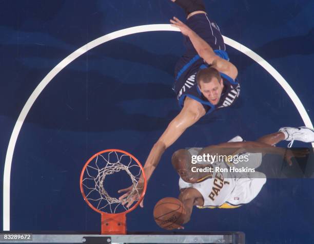 Jarrett Jack of the Indiana Pacers shoots over Dirk Nowitzki of the Dallas Mavericks at Conseco Fieldhouse on October 15, 2008 in Indianapolis,...