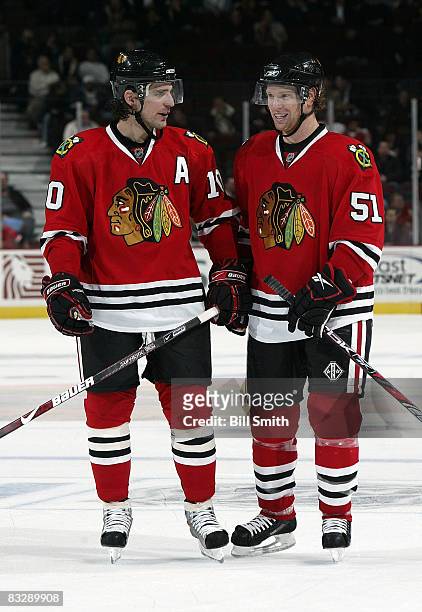 Patrick Sharp and Brian Cambell the Chicago Blackhawks talk during a break in the action against the Phoenix Coyotes October 15, 2008 at the United...