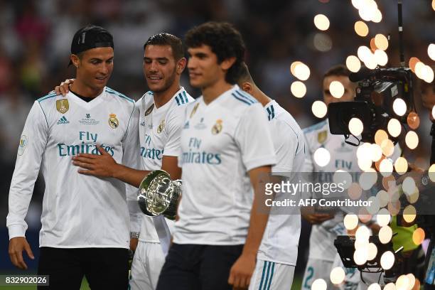 Real Madrid's Portuguese forward Cristiano Ronaldo and teammates celebrate their Supercup after winning the second leg of the Spanish Supercup...