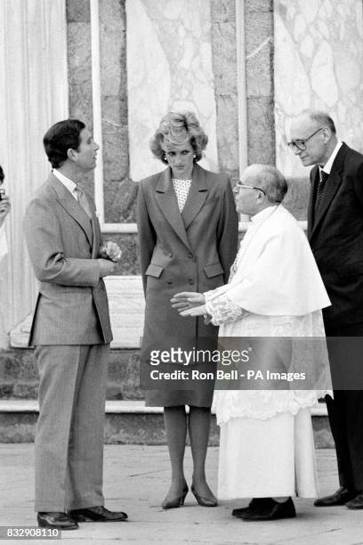 The Prince and Princess of Wales chat to Abbot Monsignor Aldinucci at the church of San Miniato in Florence.