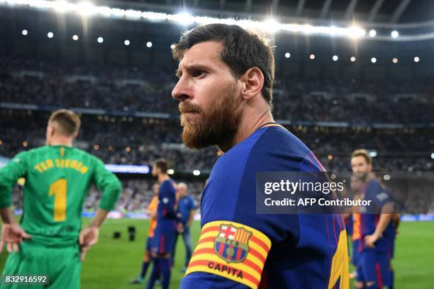 Barcelona's Argentinian forward Lionel Messi looks on after being defeated by Real Madrid at the end of the second leg of the Spanish Supercup...