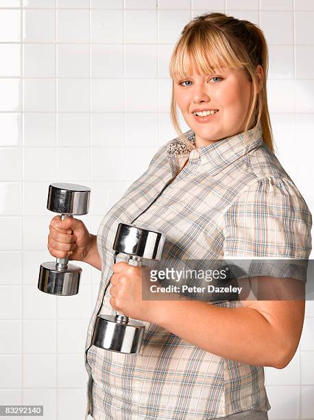 obese teenager weight training - fat girls stock pictures, royalty-free photos & images