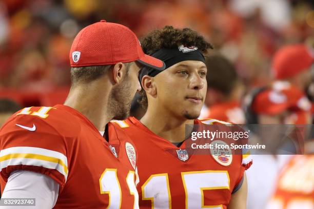 Kansas City Chiefs quarterback Alex Smith reviews plays on a table with Patrick Mahomes in the fourth quarter of an NFL week 1 preseason game between...