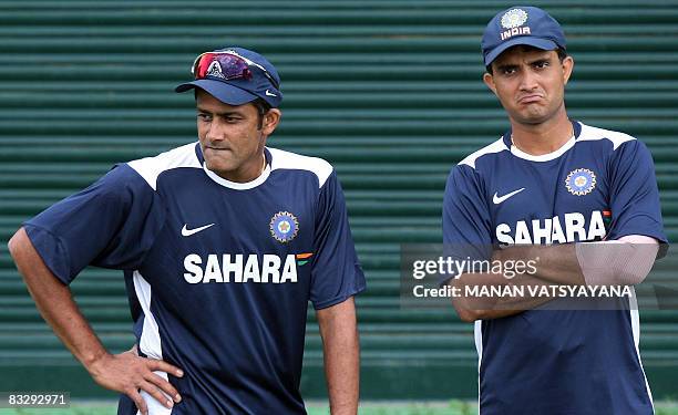 Indian cricket captain Anil Kumble and teammate Sourav Ganguly take a break during a training session at The Punjab Cricket Association Stadium in...