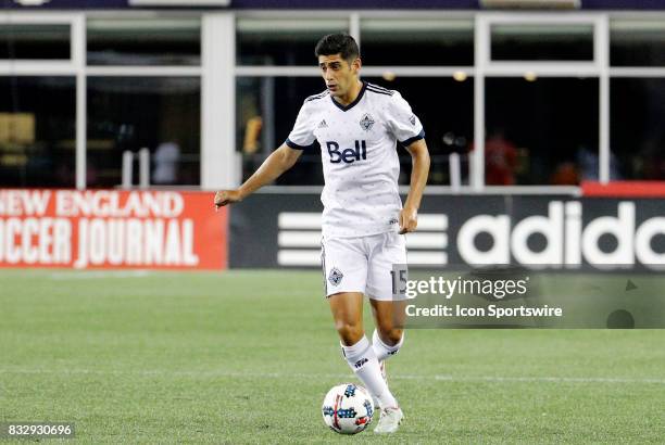 Vancouver Whitecaps midfielder Matias Laba holds the ball during an MLS match between the New England Revolution and Vancouver Whitecaps FC on August...