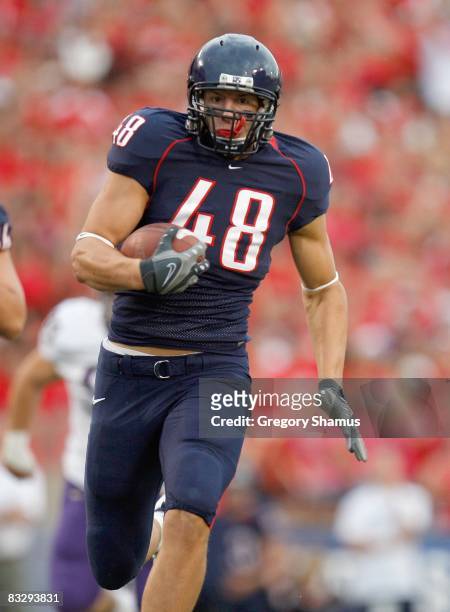 Rob Gronkowski of the Arizona Wildcats carries the ball during the game against the Washington Huskies on October 4, 2008 at Arizona Stadium in...