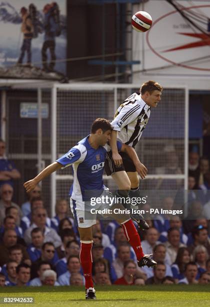 Newcastle United's James Milner and Portsmouth's Dejan Stefanovic battle for the ball.